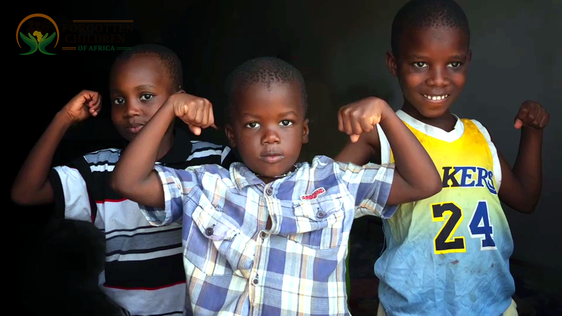 Boys flexing arms for portrait