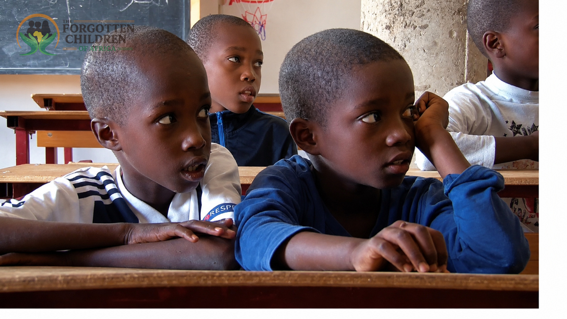 Boys learning at classroom desks