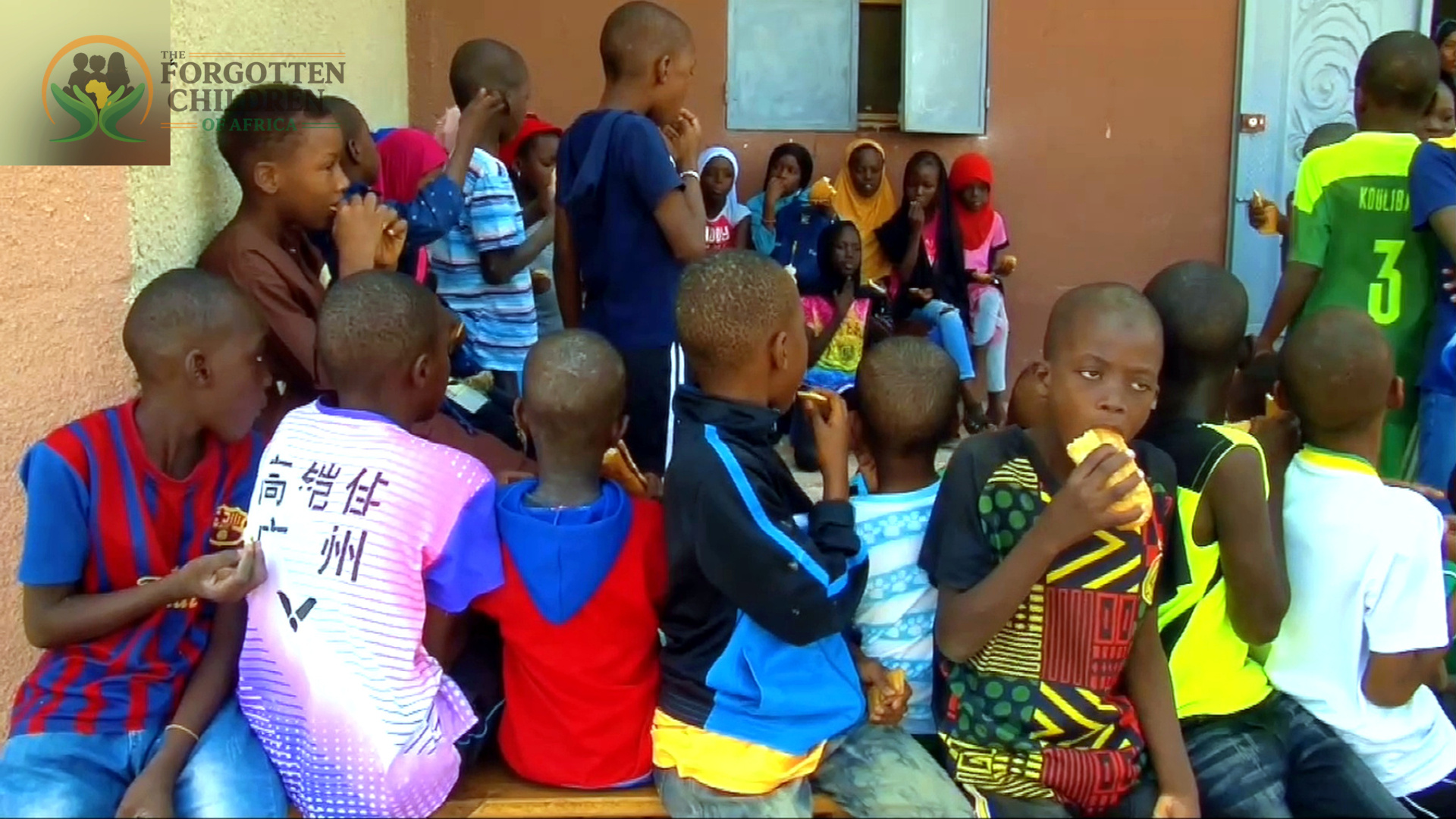 Children gathered with visitors