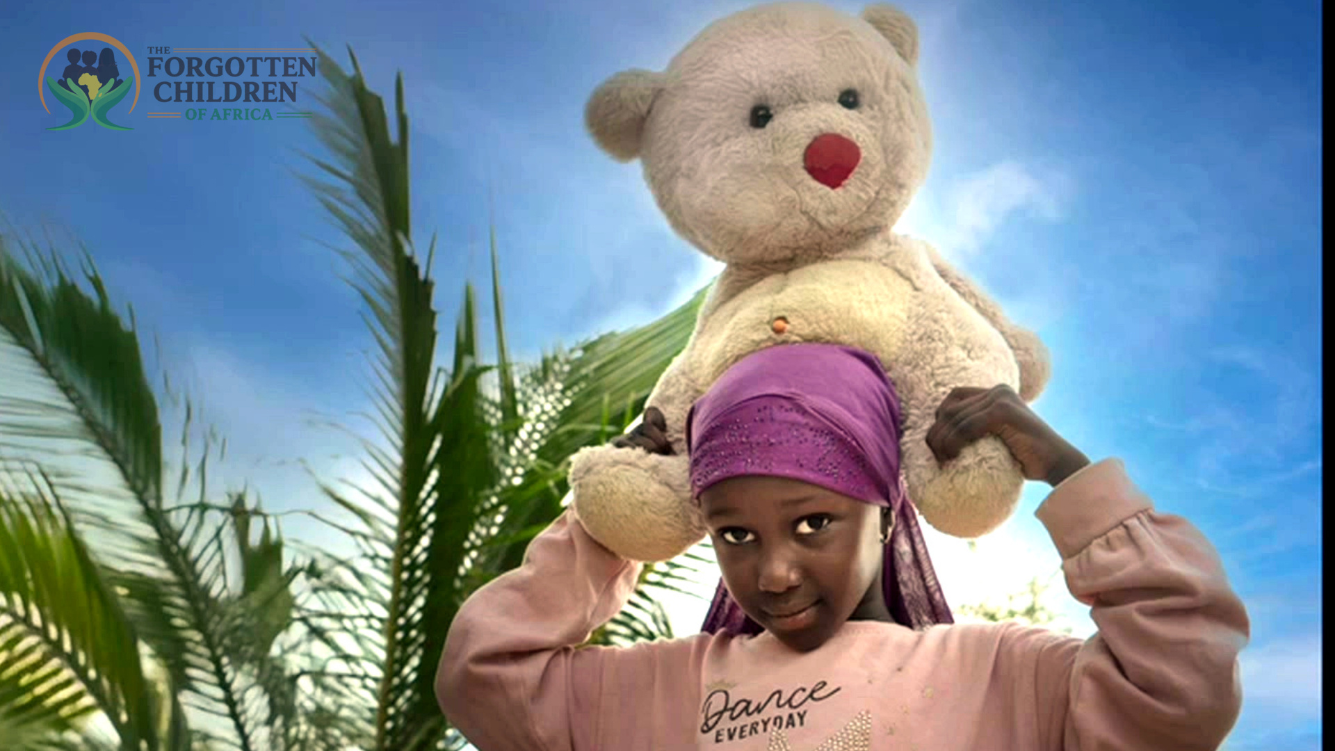 Girl carrying a large teddy bear