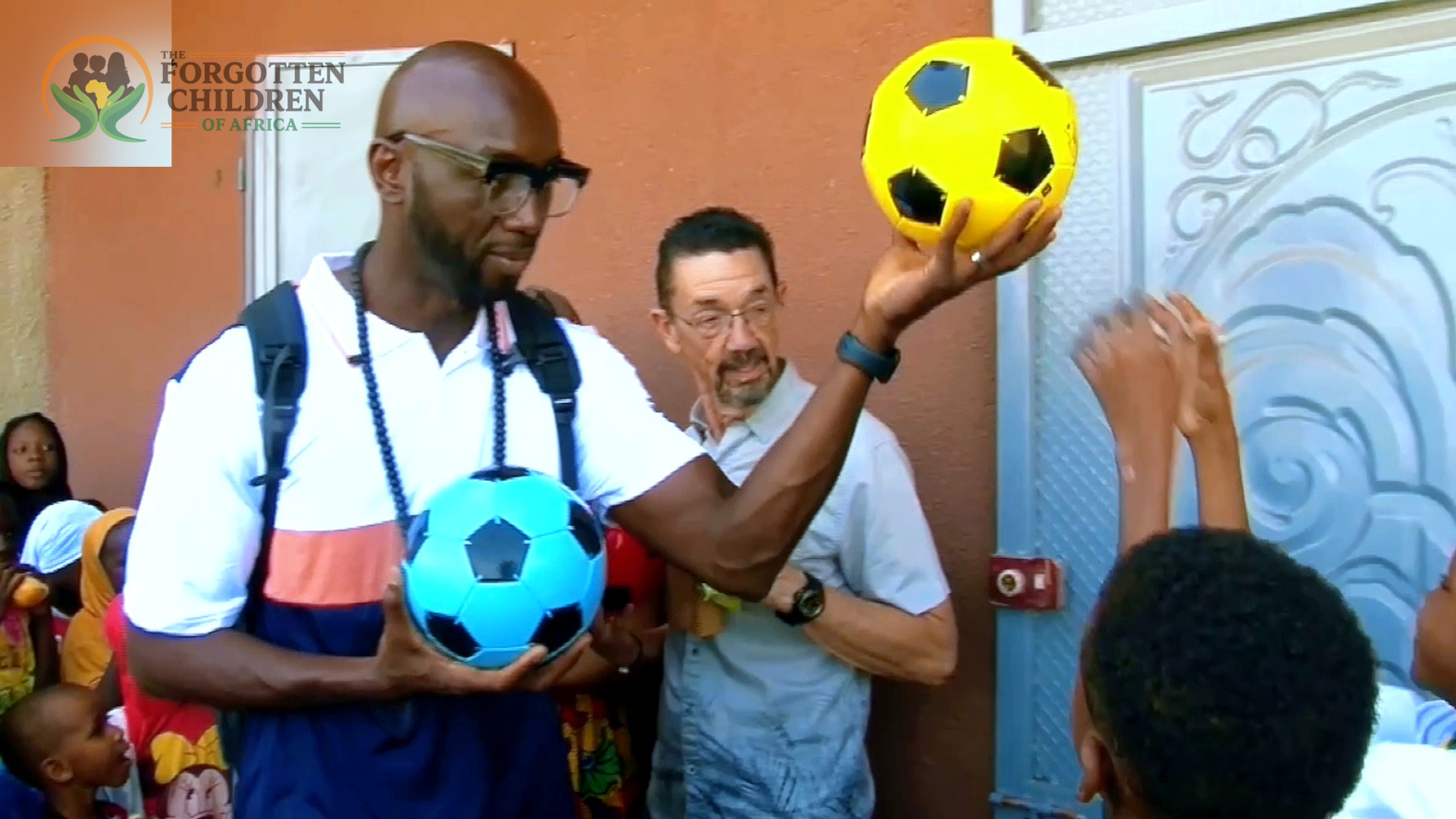 Program director showing soccer balls