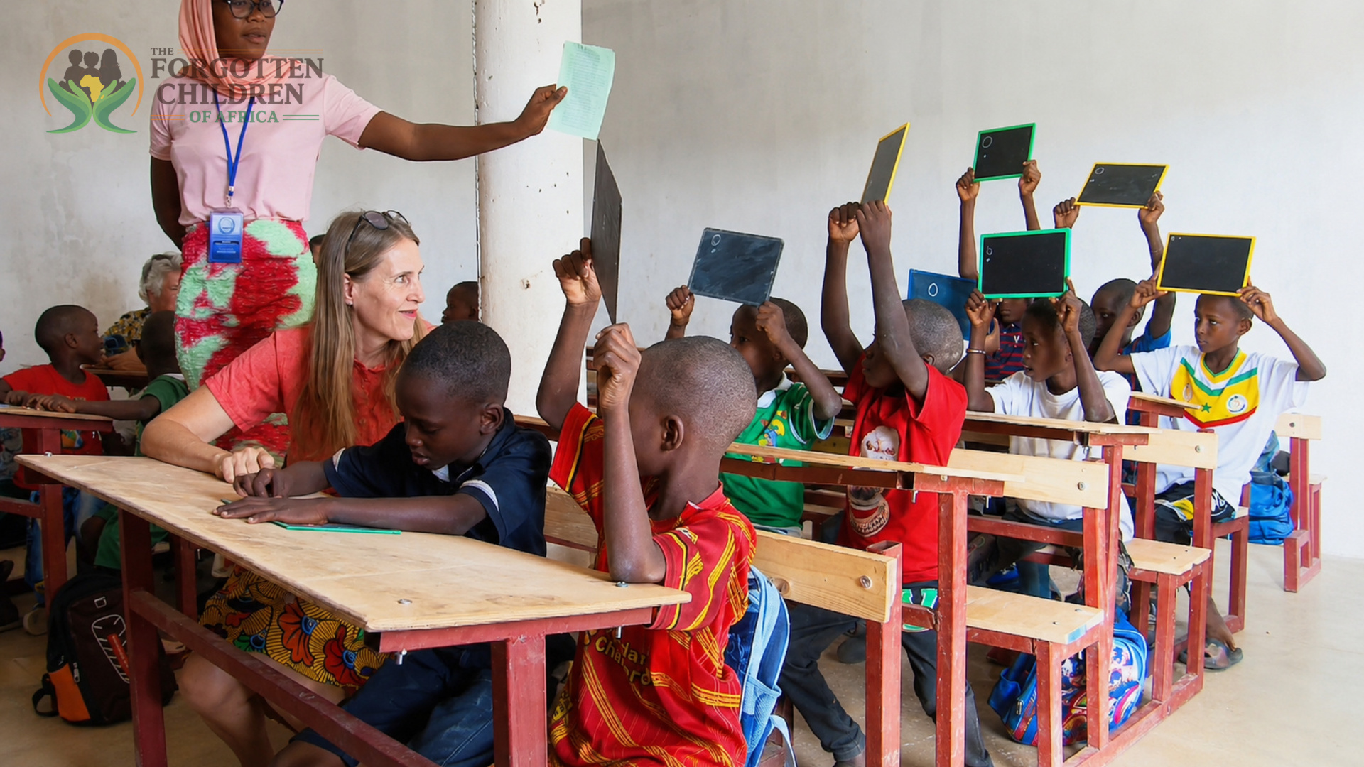 Students holding up learning materials