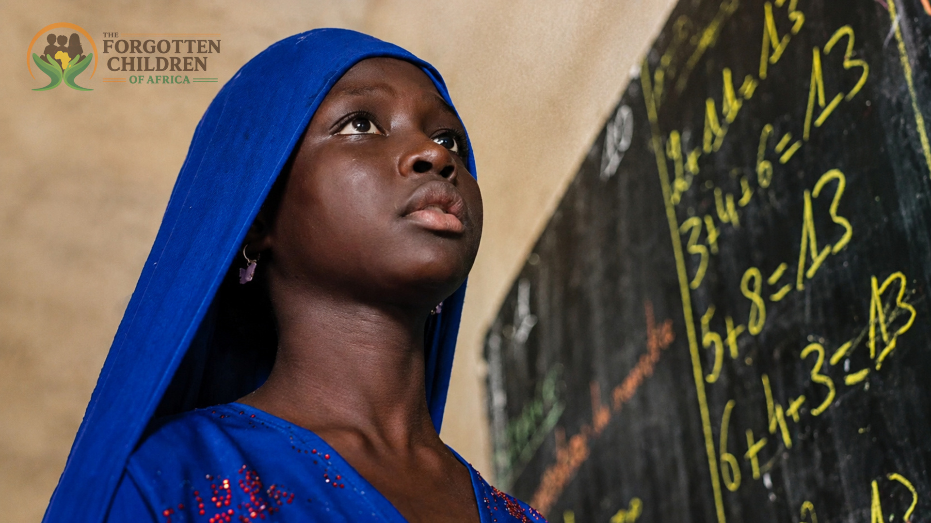 Young woman in blue headscarf by blackboard